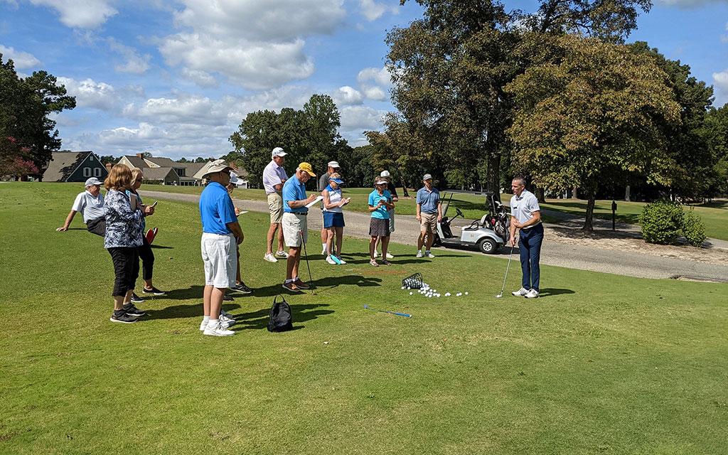 Members taking part in golf activities at Ford's Colony